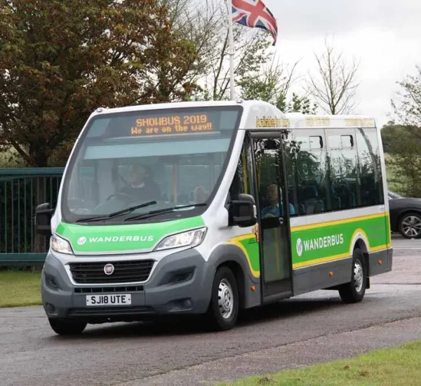 A Wanderbus minibus on a local road